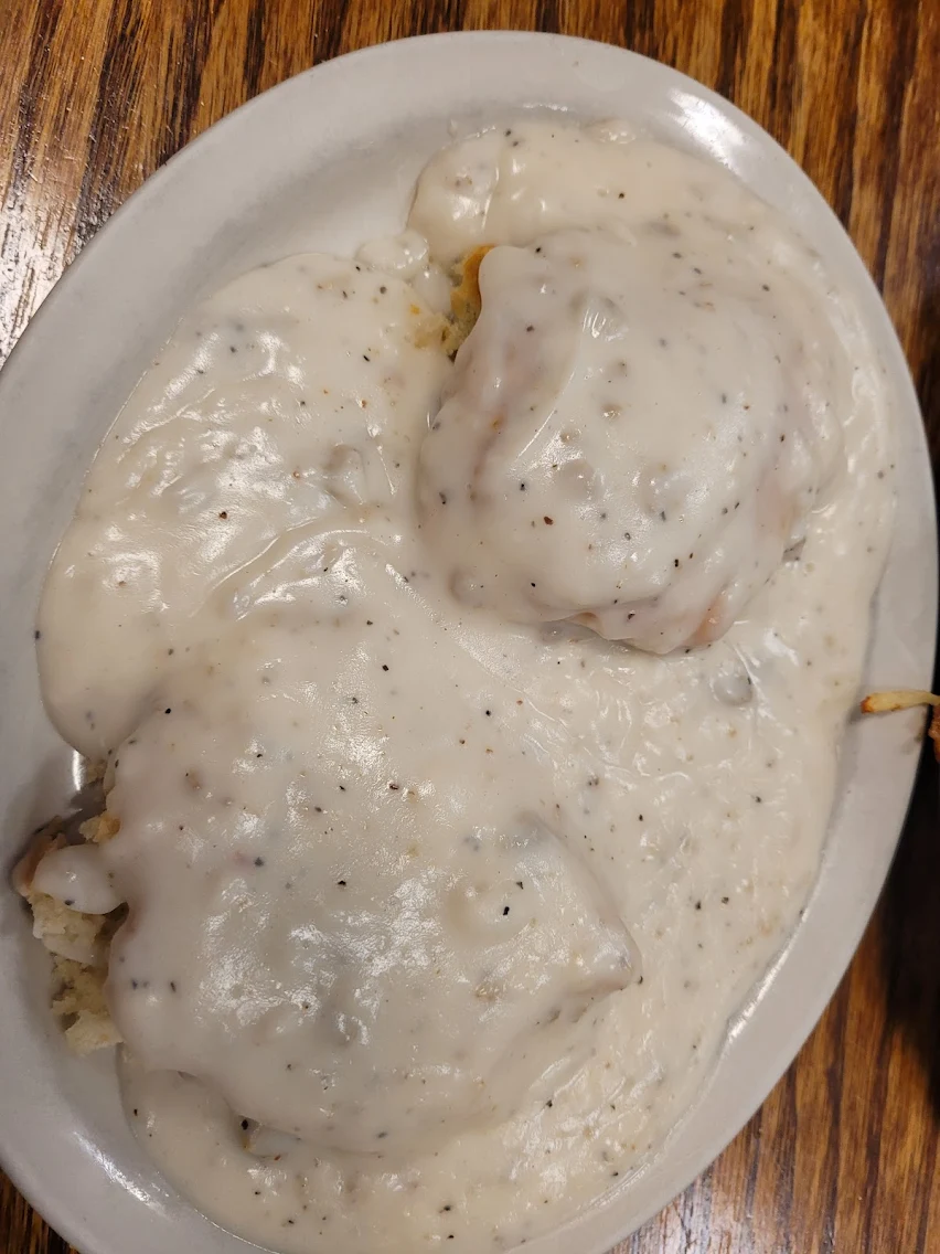 Classic biscuits smothered in thick peppery white gravy at Roxanne's Cafe, Parkville MO