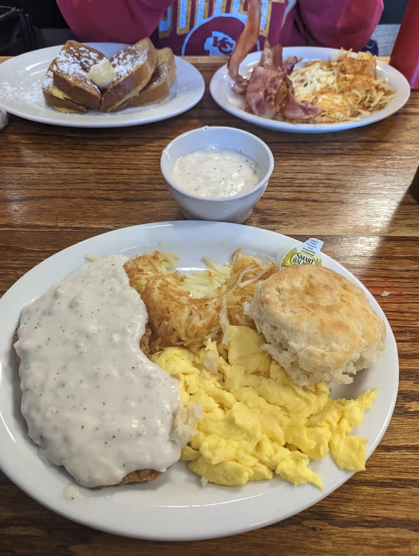 The Gunslinger breakfast plate — country fried steak with 3 eggs, hashbrowns and a biscuit at Roxanne's Cafe